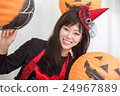 A woman who costumes a Halloween surrounded by a lantern A woman who costumes a Halloween surrounded by a lantern 24967889