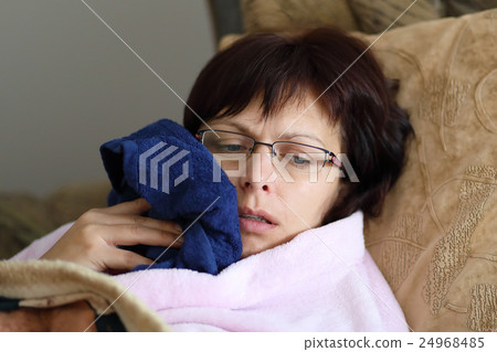 woman at home after pulling teeth 24968485