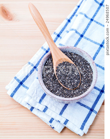 Nutritious chia seeds in ceramic bowl . 24968507