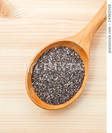 Nutritious chia seeds in wooden spoon. Nutritious chia seeds in wooden spoon. 24968508