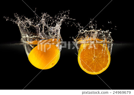 Group of fresh fruits falling in water on black 24969679