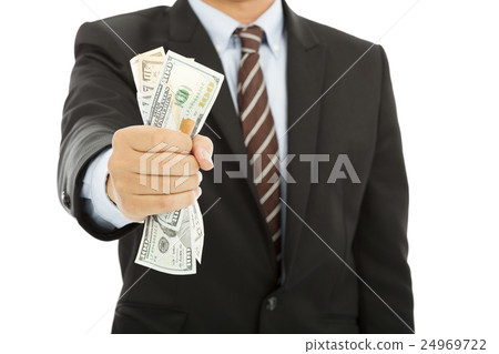 businessman holding a handful of us dollars businessman holding a handful of us dollars 24969722