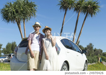 A couple driving 24970426