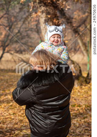 The little baby girl and grandmother standing in 24970656