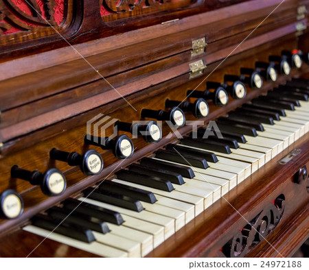 Close-up of antique reed organ harmonium 24972188