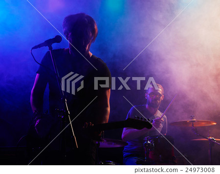 Silhouette of guitar player on stage. Silhouette of guitar player on stage. 24973008