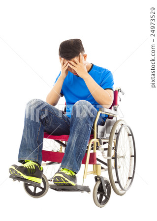 upset handicapped man sitting on a wheelchair 24973529