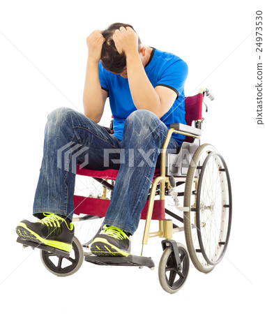 depressed   man sitting on a wheelchair 24973530