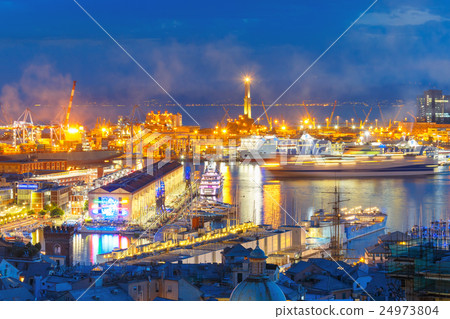 Old Lighthouse in port of Genoa at night, Italy. 24973804