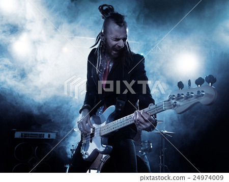 Bassist in the foreground. 24974009