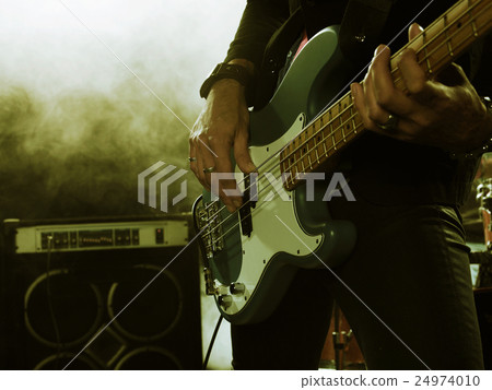 Bassist in the foreground. Bassist in the foreground. 24974010