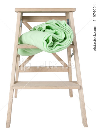 green blanket on a stepladder isolated on white   24974094