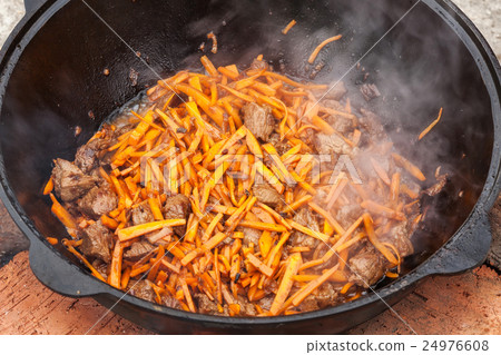 Pilaf, pilaw, plov, rice with meat in pan. Cooking 24976608