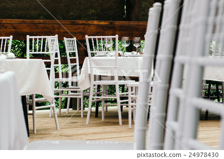 Wedding event. Chiavari chairs on the covered Wedding event. Chiavari chairs on the covered 24978430