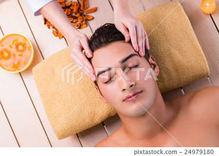 Man during massage session in spa salon 24979180