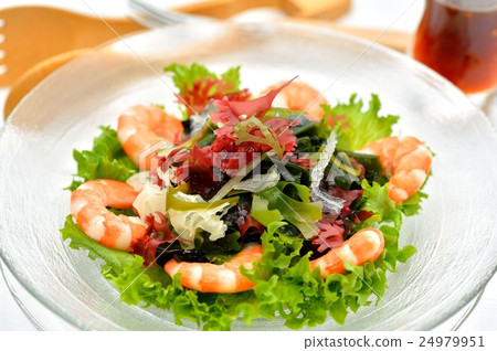 Seaweed salad (raw seaweed, boiled shrimps etc), accompanied with soy sauce dressing. 24979951