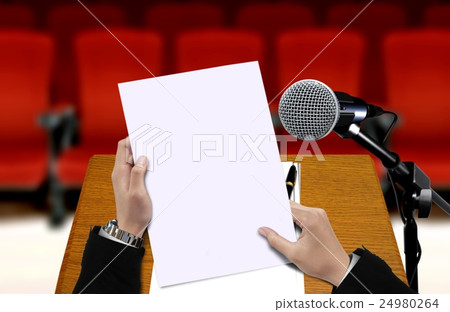Man holding presentation sheet 24980264