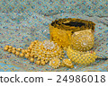 Golden jewelry on  elegance fabric 24986018