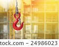 Red lifting crane hook on construction site. 24986023