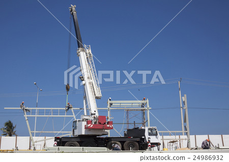 Crane and metal structures at a construction field 24986932
