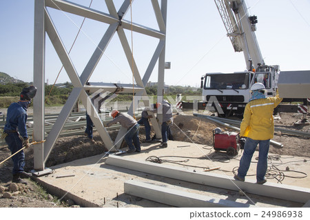 Crane and metal structures at a construction field Crane and metal structures at a construction field 24986938