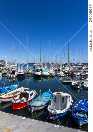 Small boats in harbor 24996987