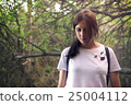 Portrait of young woman in the forest 25004112