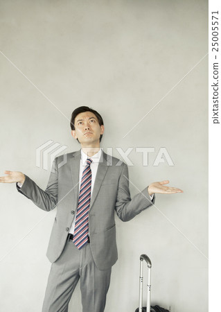A businessman with a carry case A businessman with a carry case 25005571