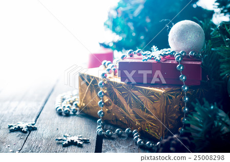 Holiday Boxes with beads on Wooden Background. 25008298