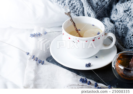 Warm knitted sweater,cup of hot tea Warm knitted sweater,cup of hot tea 25008335