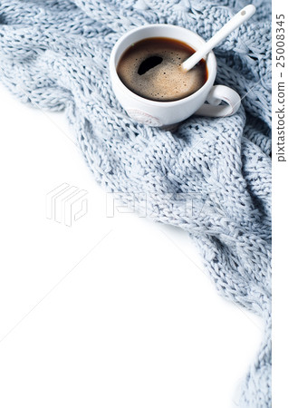 cup of coffee with scarf close-up 25008345