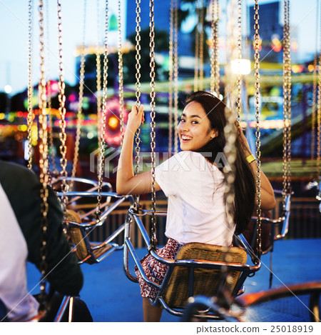 Woman Carnival Ride Riding Happiness Fun Concept Woman Carnival Ride Riding Happiness Fun Concept 25018919