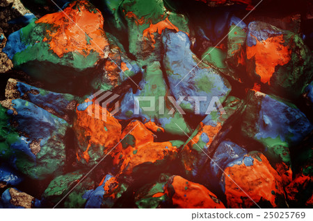 pebbles painted in different colors 25025769