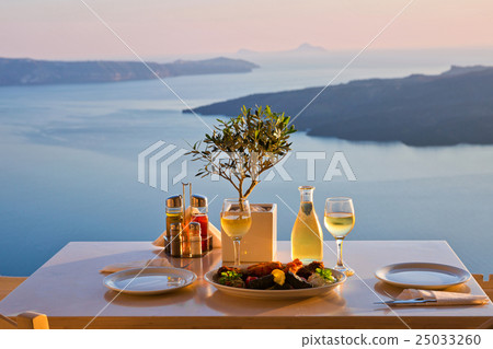 Dinner for two on a sunset background 25033260