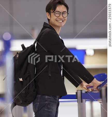 A man waiting for departure at the airport A man waiting for departure at the airport 25033379