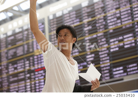 A man waiting for departure at the airport A man waiting for departure at the airport 25033410