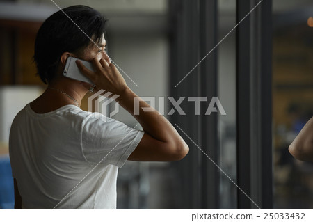 A man waiting for departure at the airport A man waiting for departure at the airport 25033432