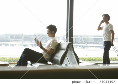 A man waiting for departure at the airport A man waiting for departure at the airport 25033492