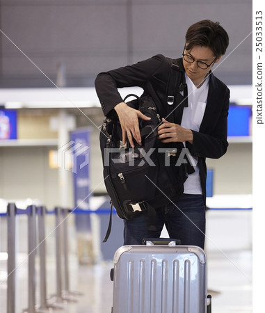 A man waiting for departure at the airport A man waiting for departure at the airport 25033513