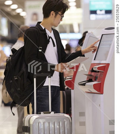 A man waiting for departure at the airport A man waiting for departure at the airport 25033629