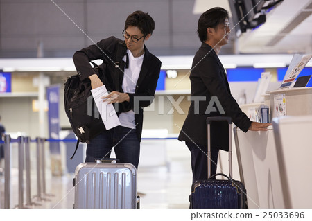 A man waiting for departure at the airport A man waiting for departure at the airport 25033696