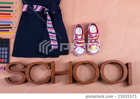 School uniform near sneakers and supplies School uniform near sneakers and supplies 25035373