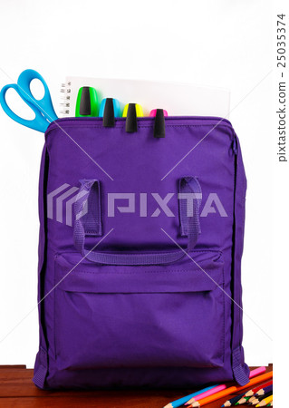 Open purple backpack with school supplies 25035374