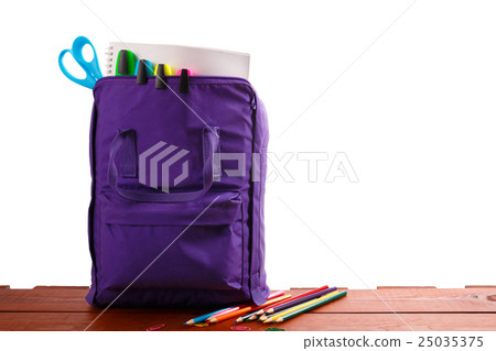 Open purple backpack with school supplies Open purple backpack with school supplies 25035375