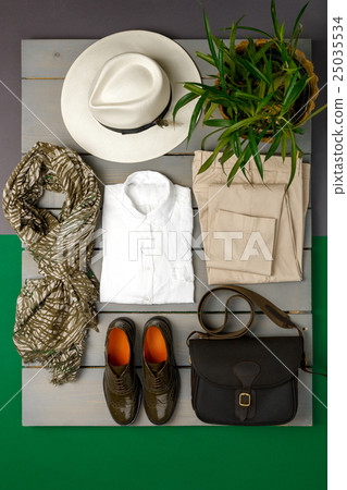 Women's outfit on wooden background 25035534