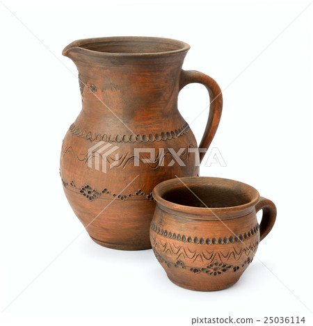 Clay jug and cup isolated on white Clay jug and cup isolated on white 25036114