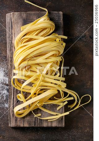 Raw homemade pasta tagliatelle Raw homemade pasta tagliatelle 25036966