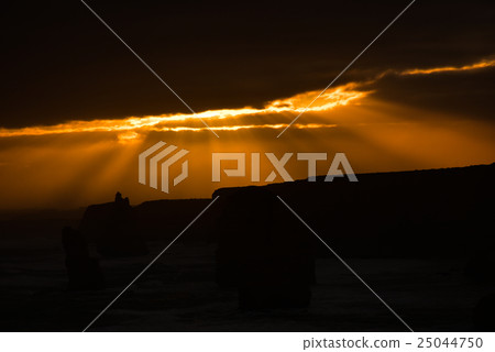 The sunset lightens the Australian Great Ocean Road's Twelve Apostles 25044750