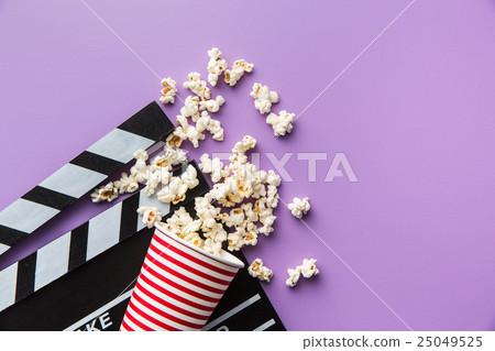 popcorn and clapperboard popcorn and clapperboard 25049525