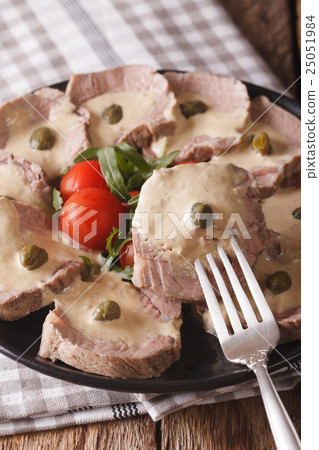 Italian beef with tuna sauce close-up. vertical Italian beef with tuna sauce close-up. vertical 25051984
